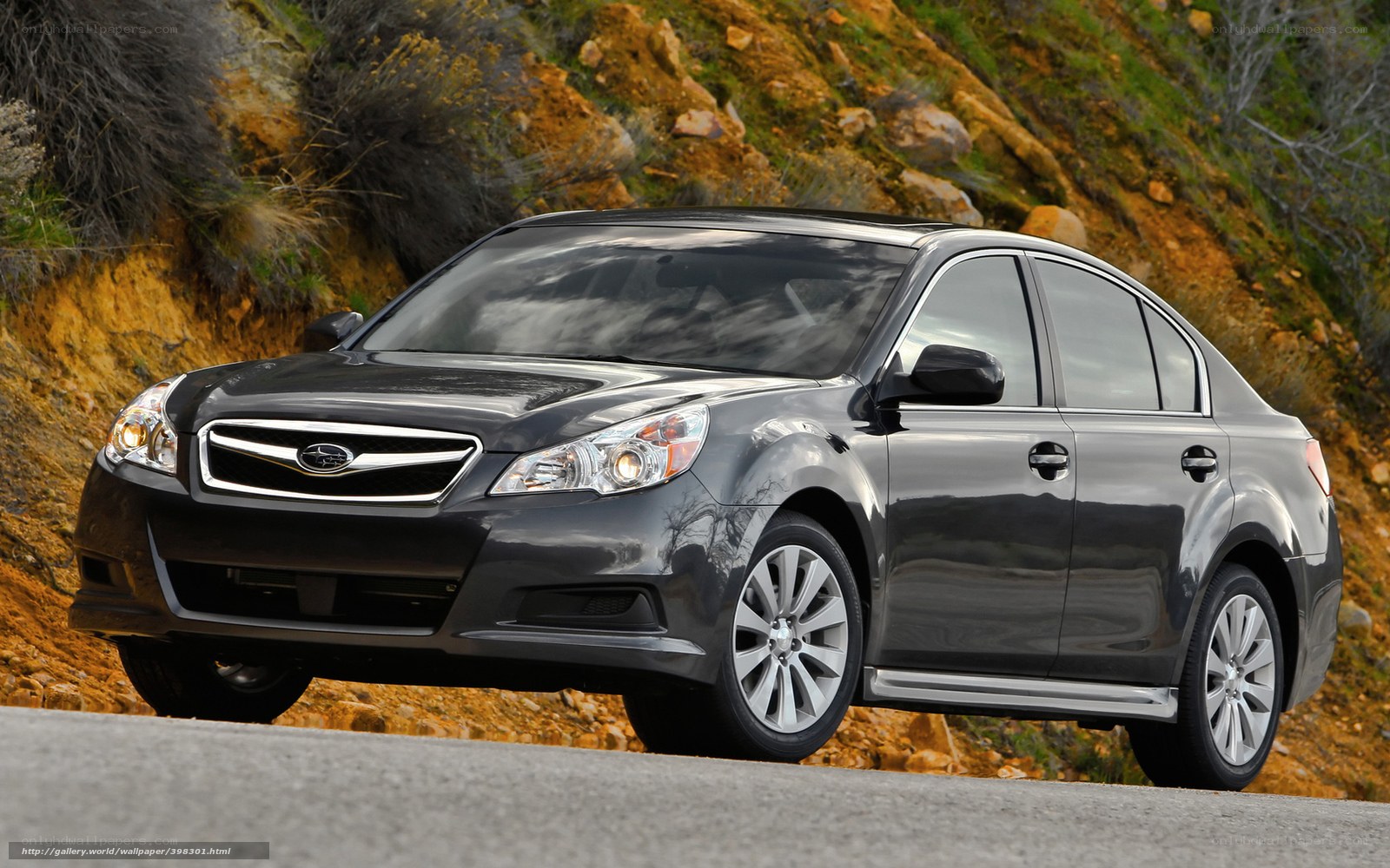 Black Subaru Legacy on a road