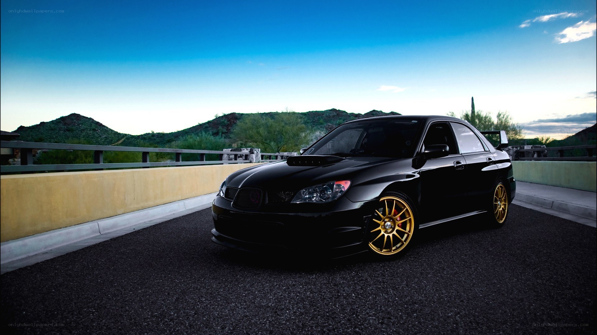 black subaru on a bridge