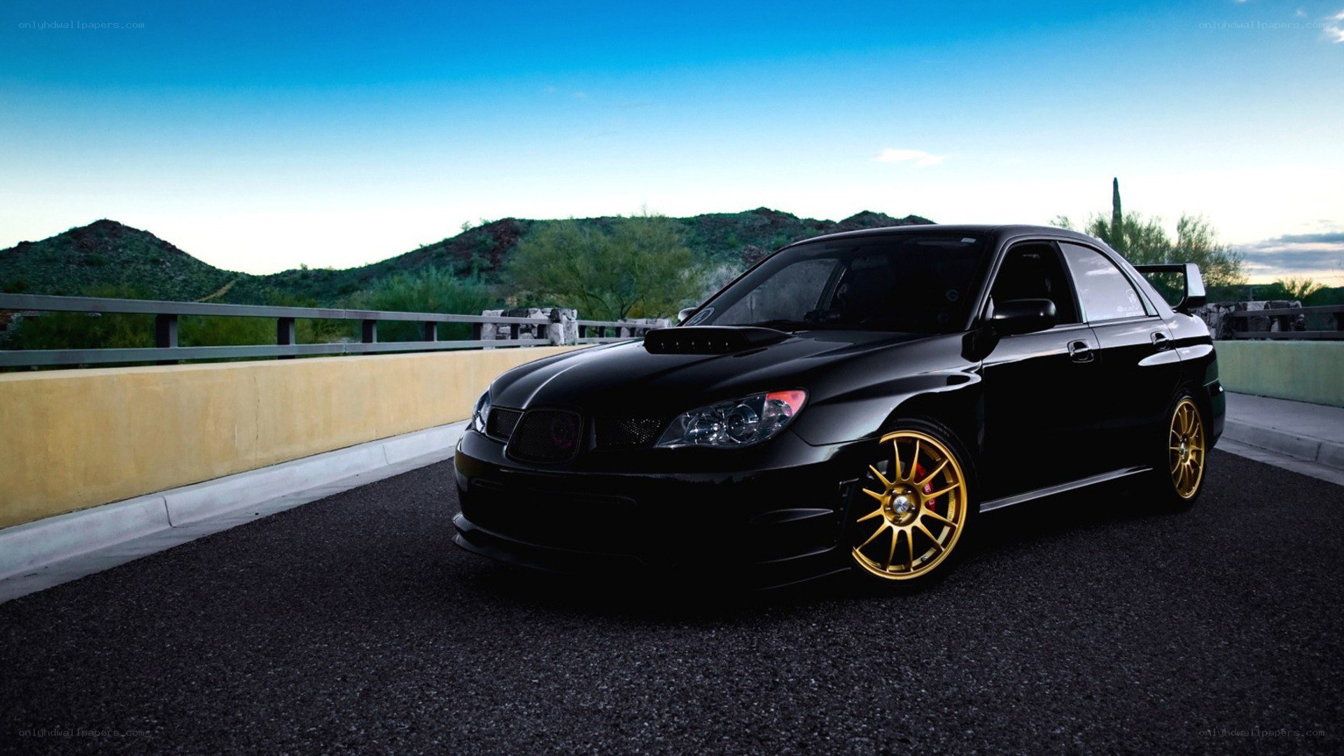 black subaru on a bridge