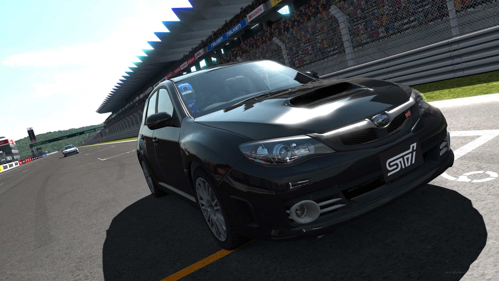 Black Subaru on a racetrack