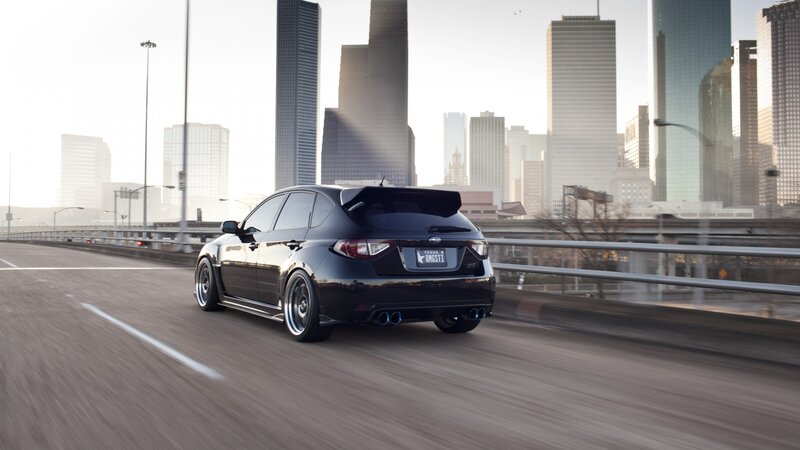 black subaru on city highway