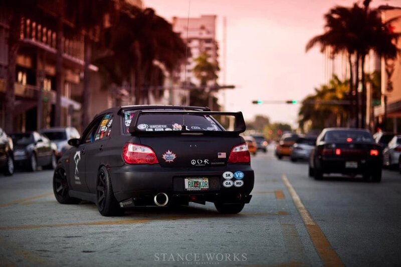 black subaru on city street