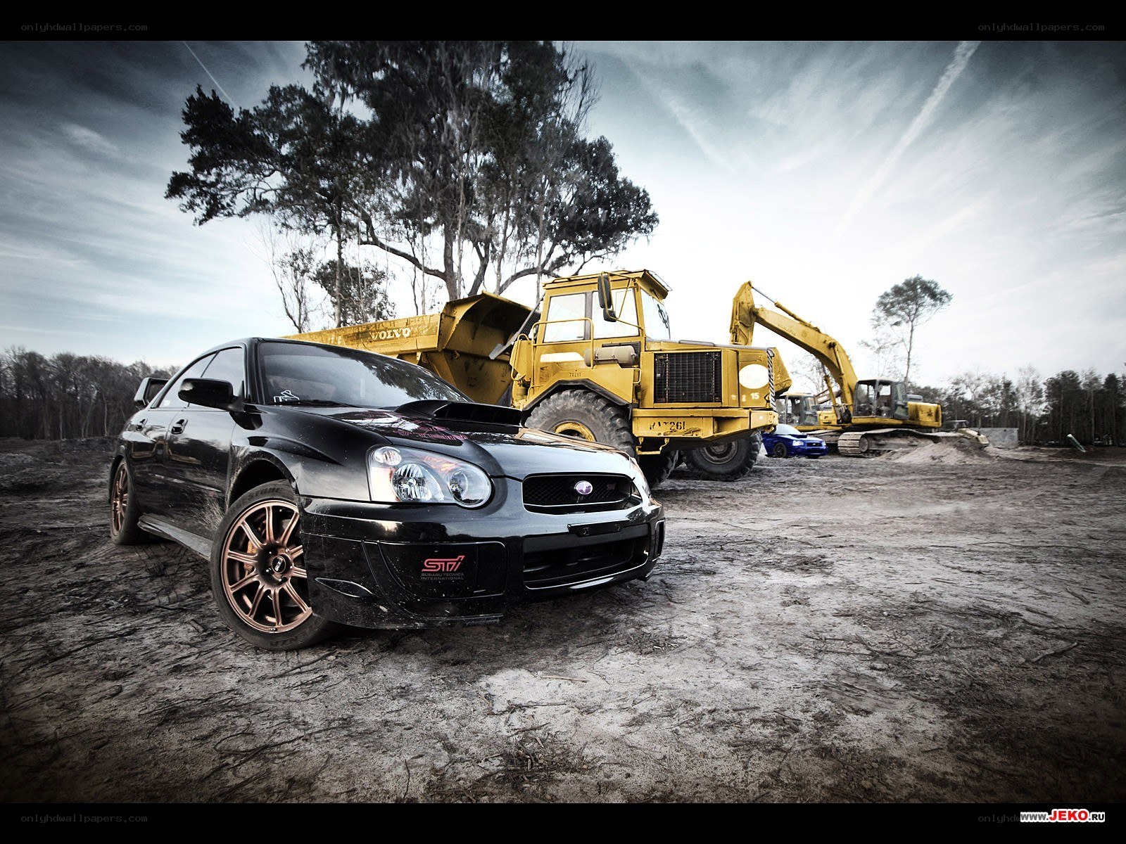 Black Subaru on construction site