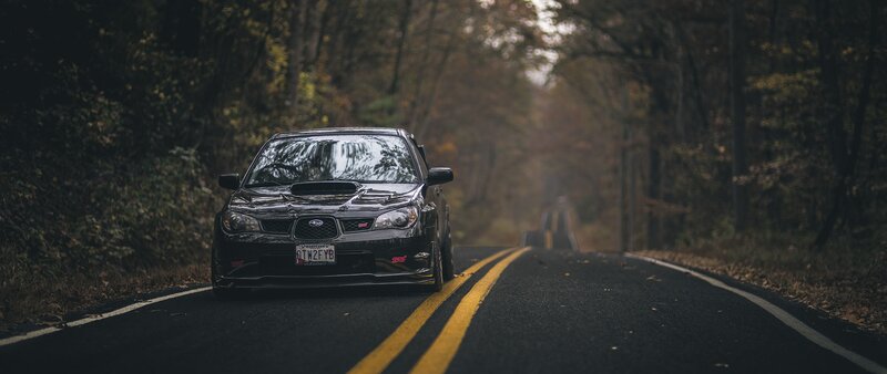 Black Subaru on Road — Serene