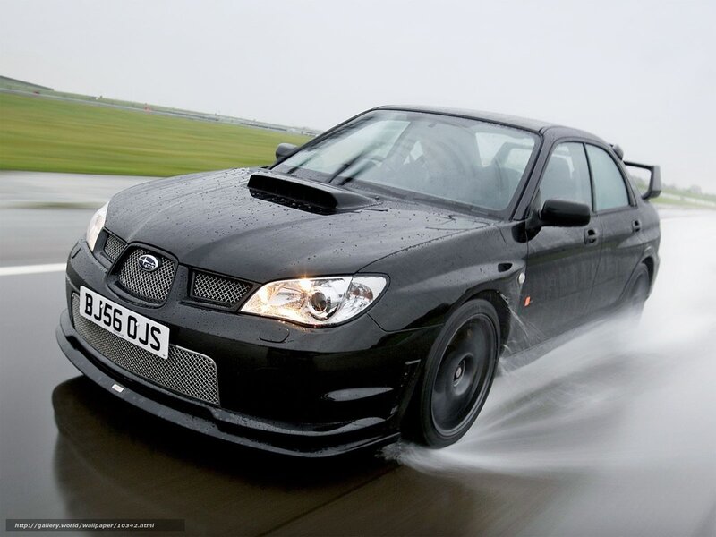 black subaru on wet track