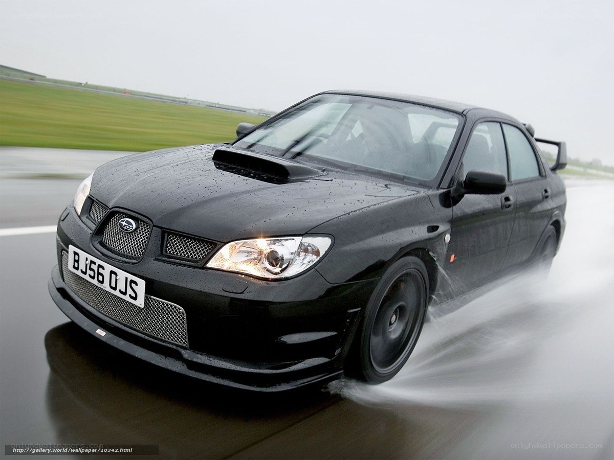 black subaru on wet track