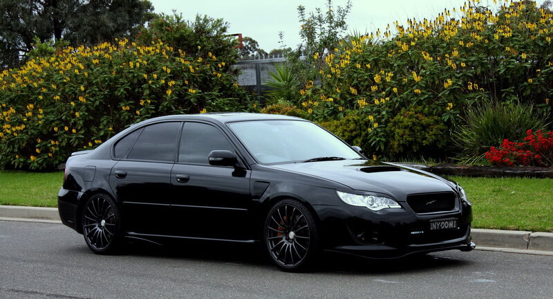 black subaru sedan on street