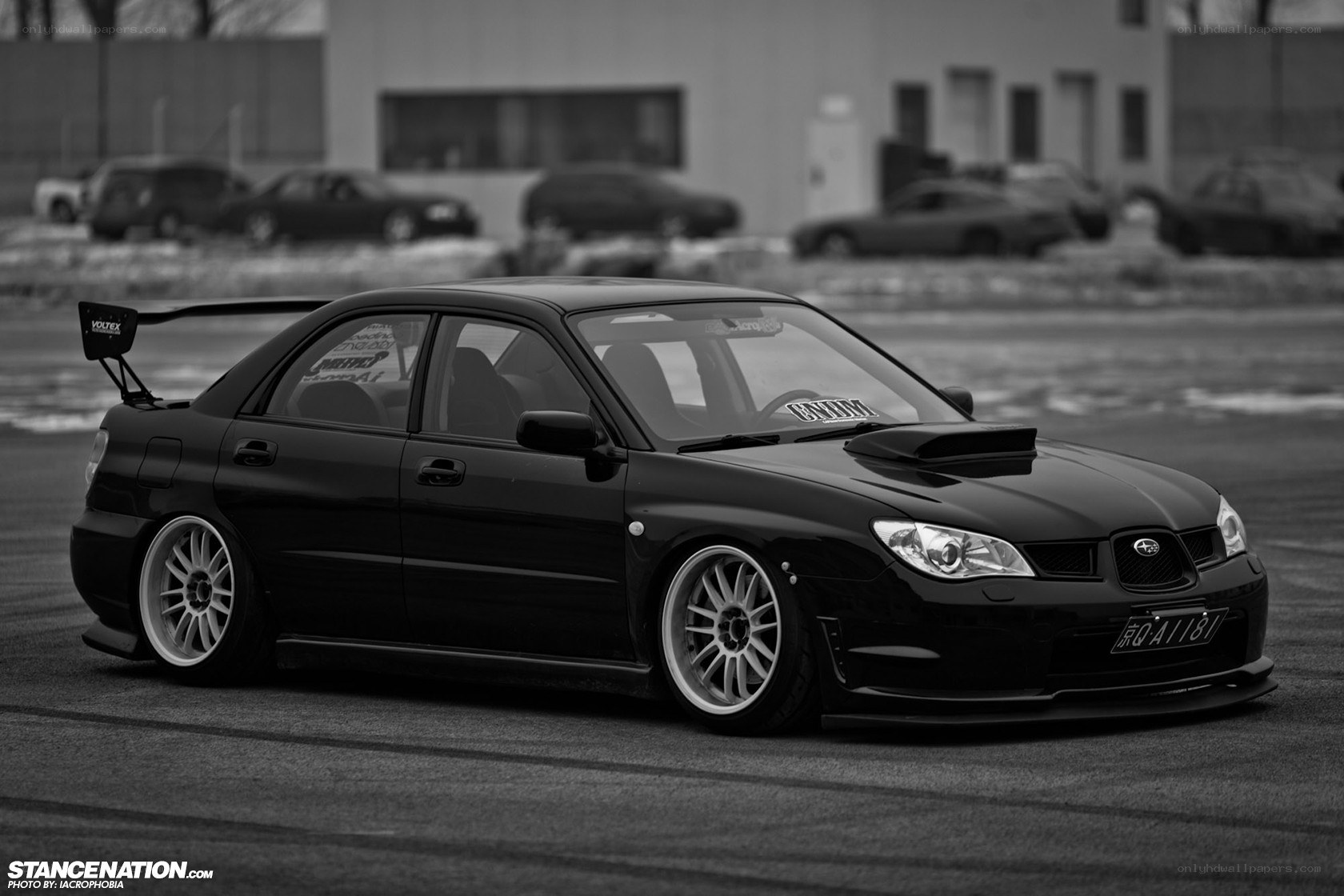black subaru stanced on track