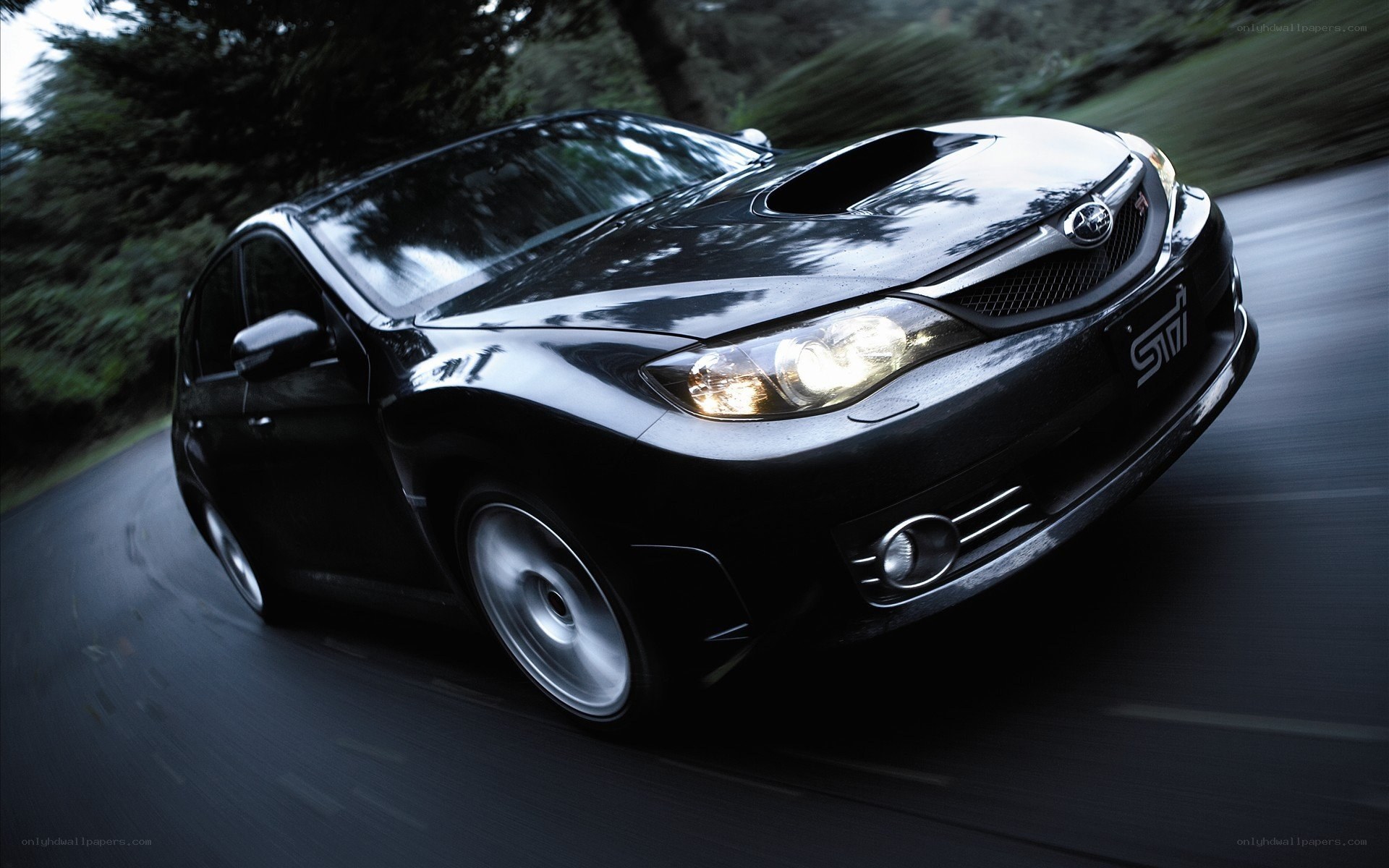 black subaru sti in motion