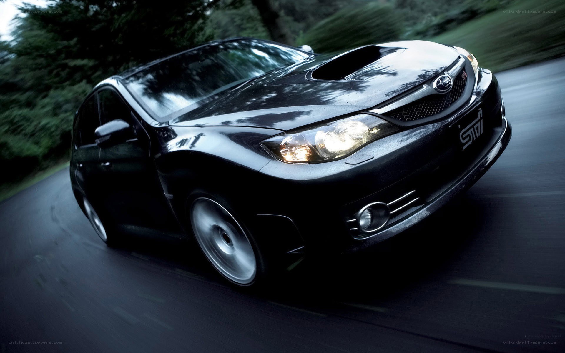 black subaru sti in motion