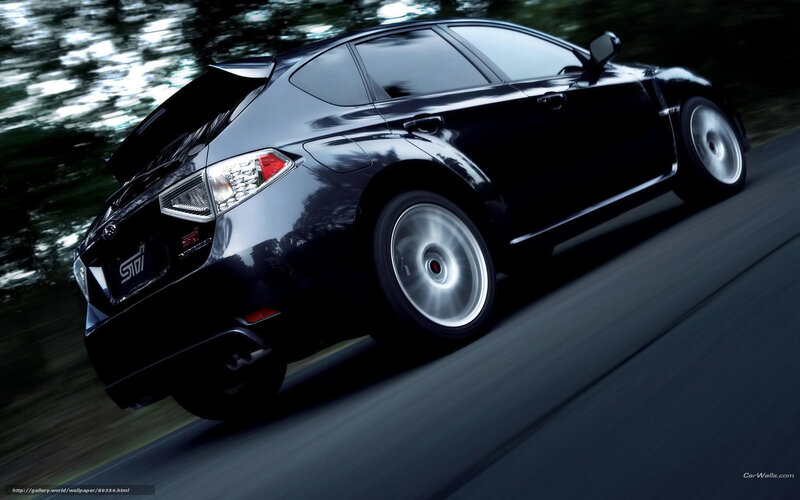 black subaru sti in motion