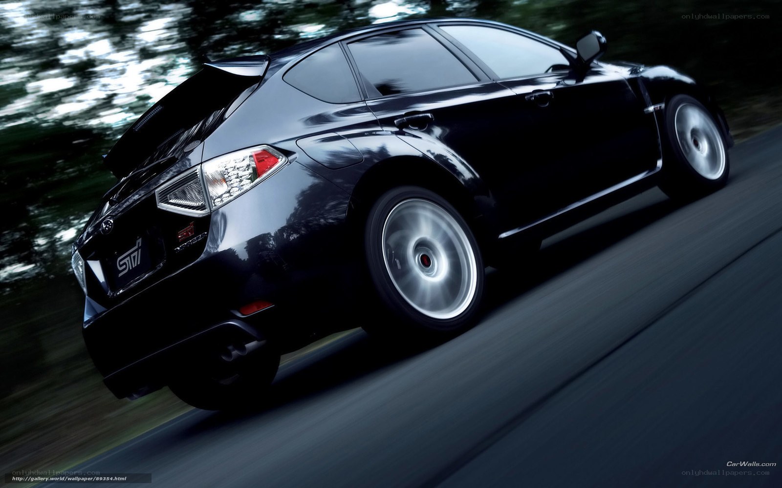 black subaru sti in motion