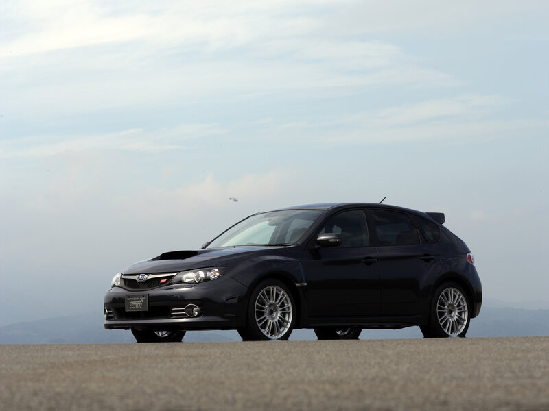 Black Subaru STI on a road