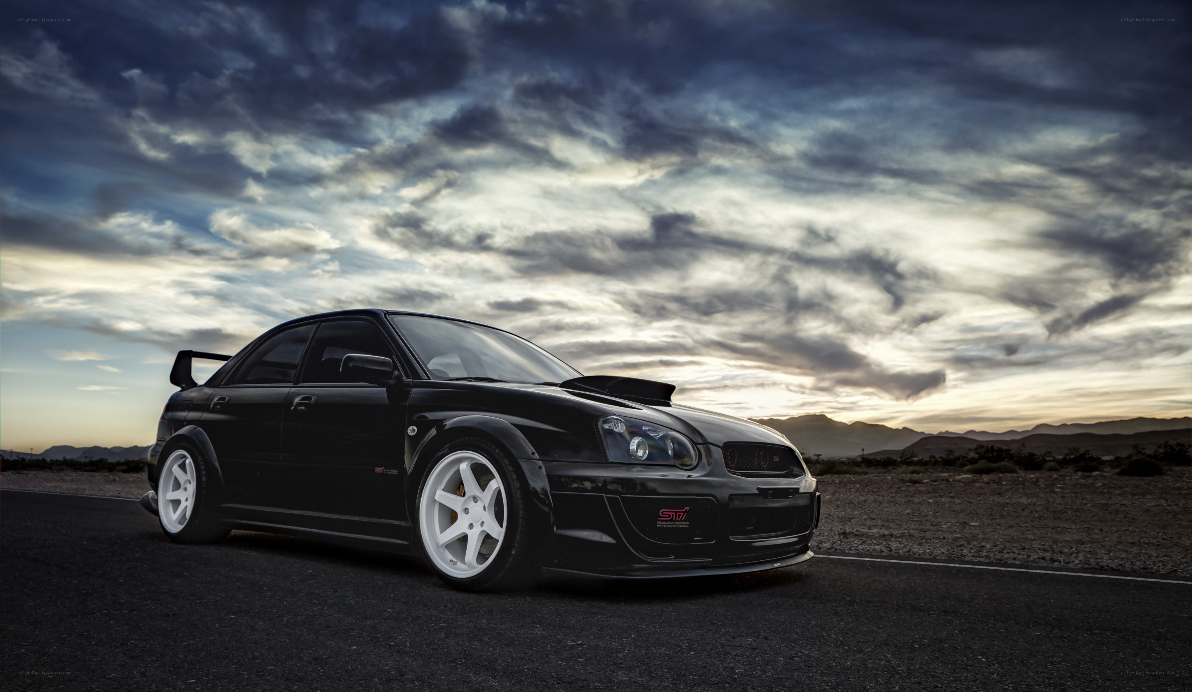 black subaru sti on desert road