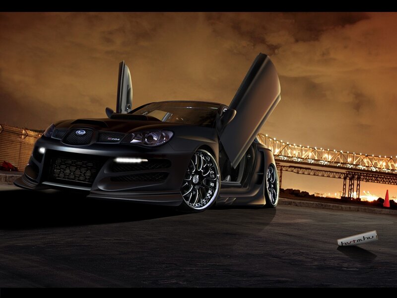 Black Subaru with doors open