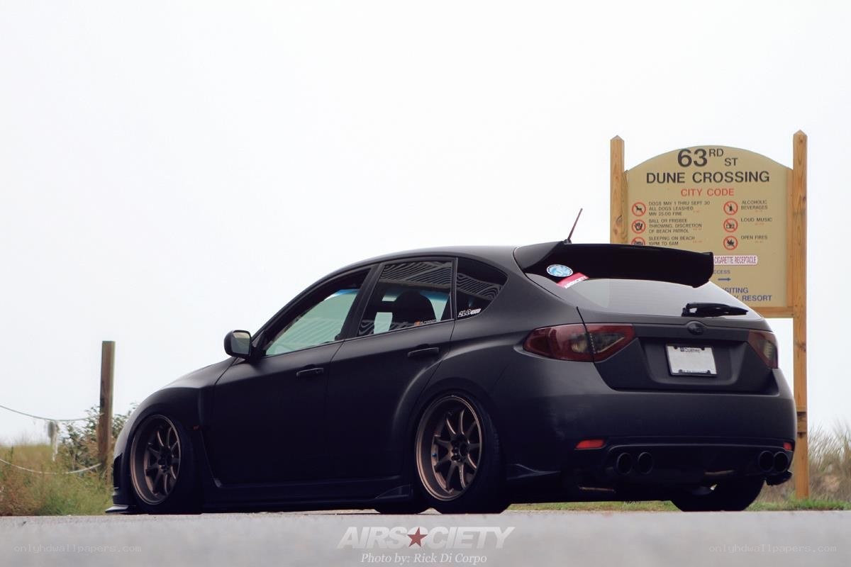 Black Subaru WRX at Dune Crossing