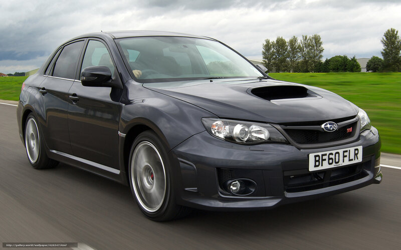 Black Subaru WRX in motion