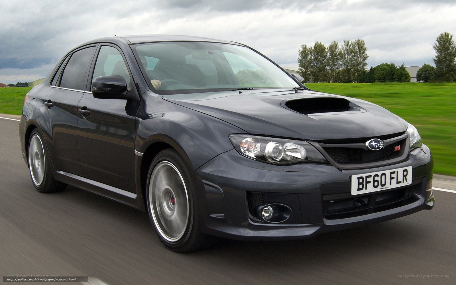 Black Subaru WRX in motion
