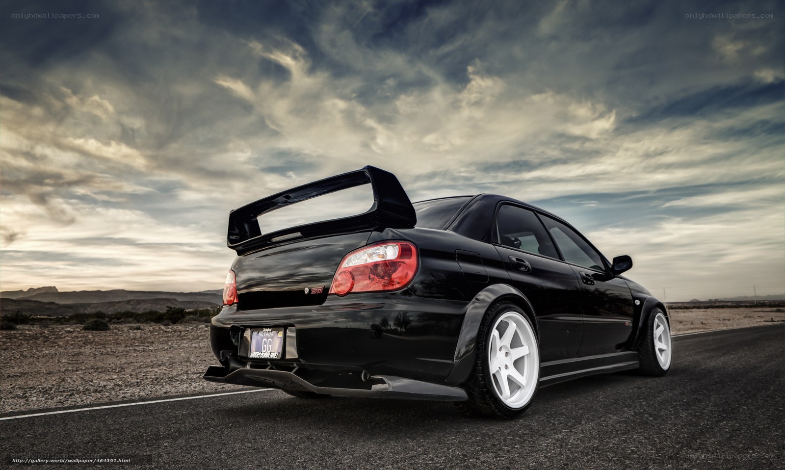 Black Subaru WRX on desert road