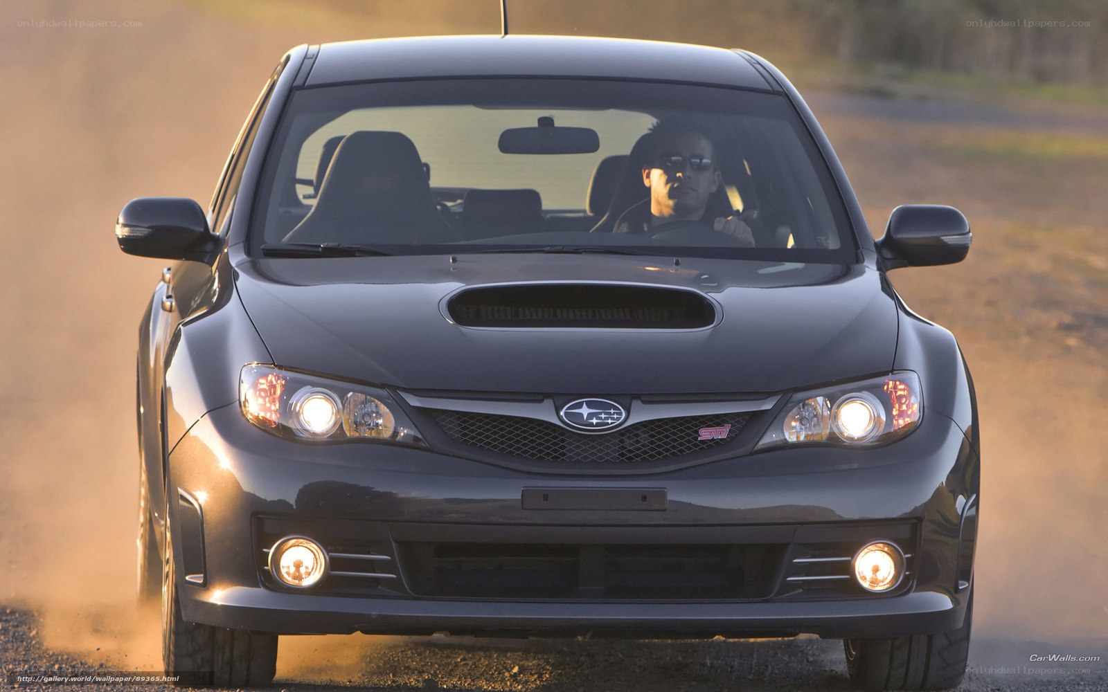 black subaru wrx sti driving