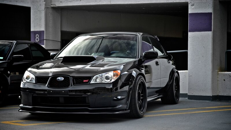 black subaru wrx sti in garage