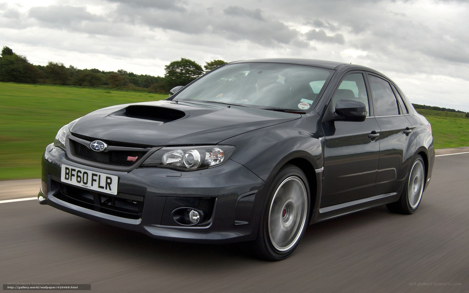 black subaru wrx sti in motion