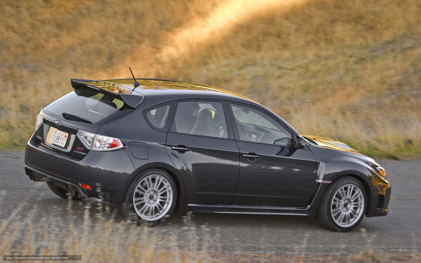 black subaru wrx sti on road