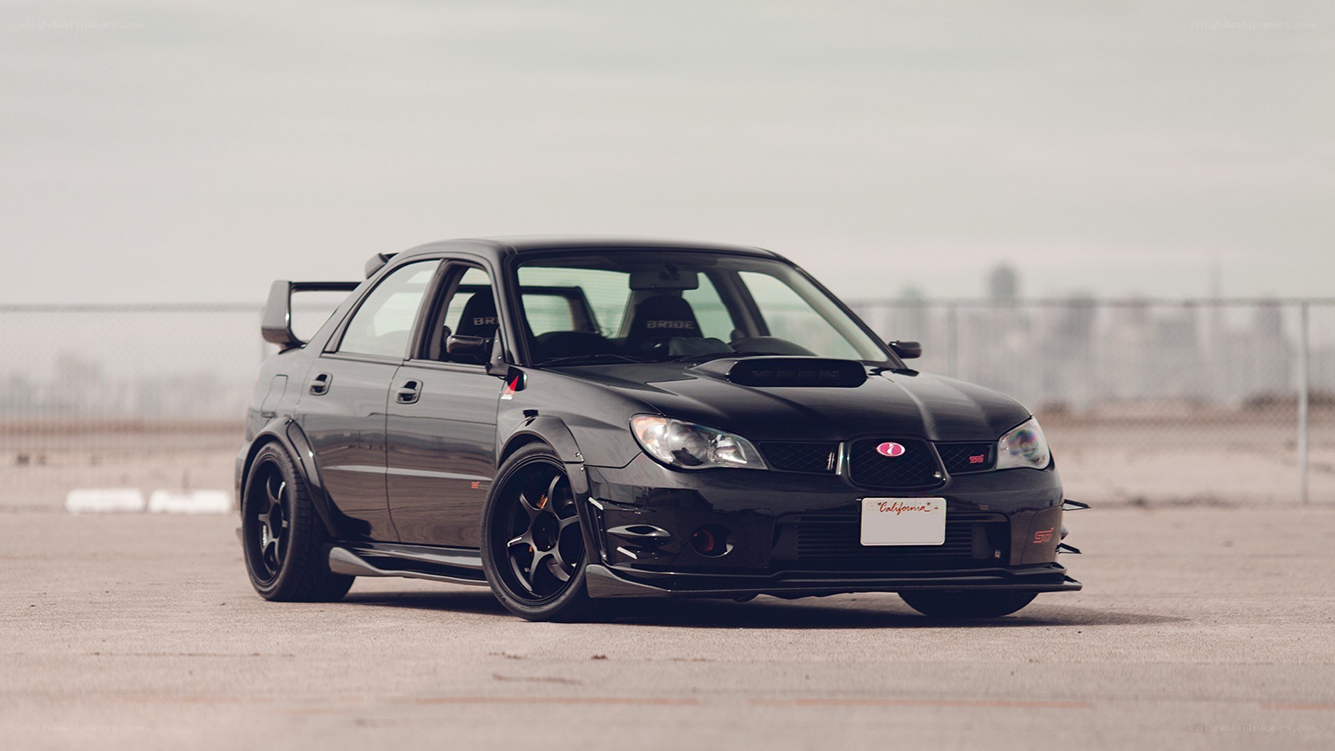 black subaru wrx sti on track