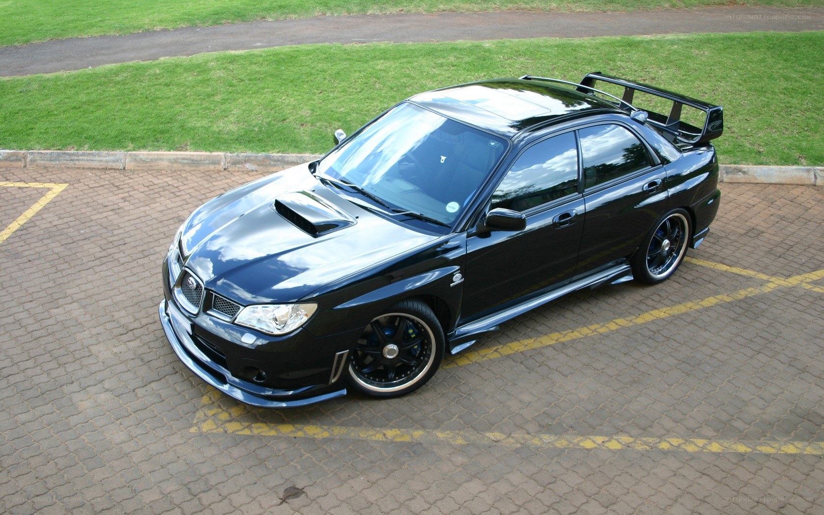 black subaru wrx sti parked