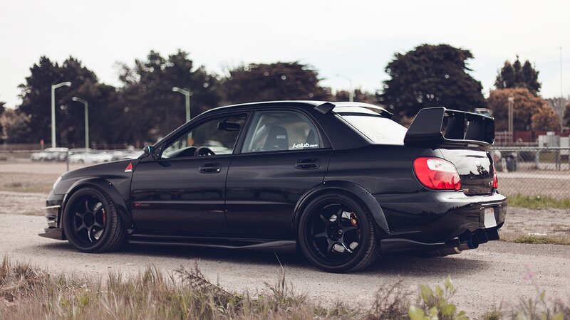 black subaru wrx sti with rear wing