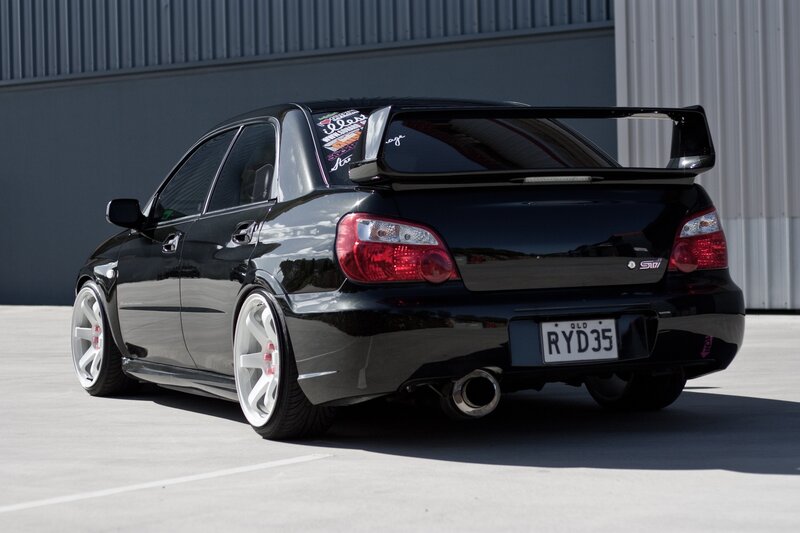 black subaru wrx sti with rear wing