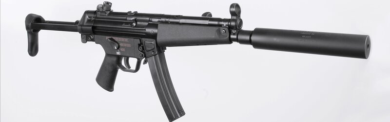 Black submachine gun with suppressor