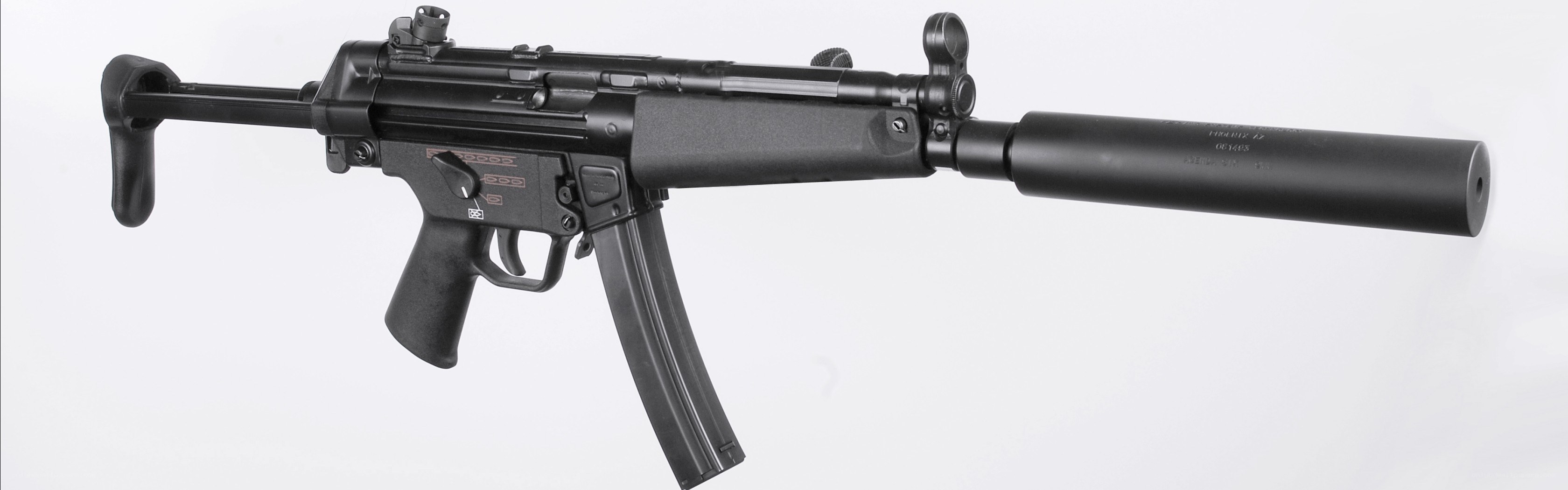 Black submachine gun with suppressor
