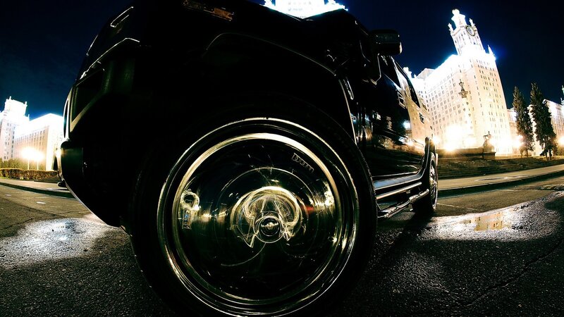 Black SUV at night in city