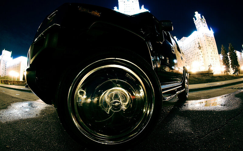 Black SUV at night in city