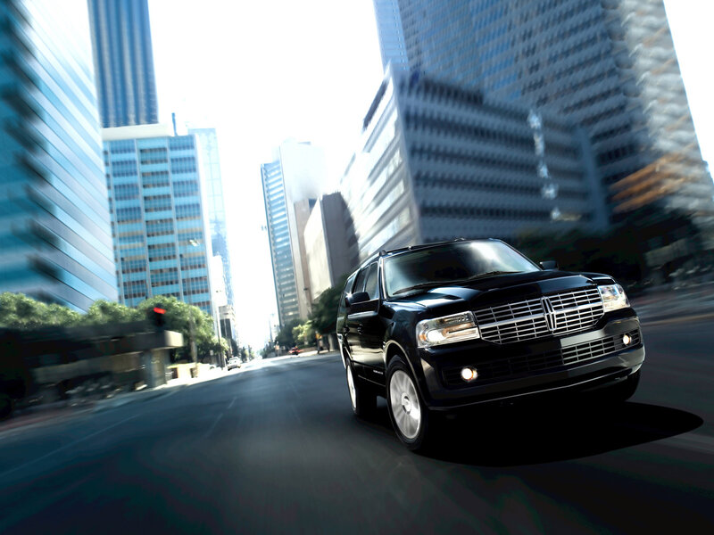Black SUV driving in city