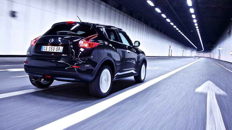 Black SUV driving in tunnel