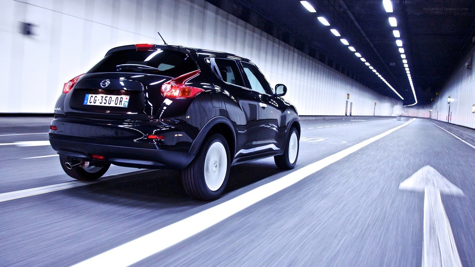 Black SUV driving in tunnel