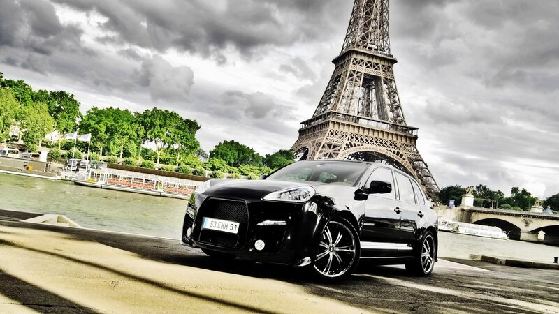 Black SUV in front of Eiffel Tower