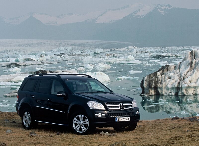 Black SUV in icy landscape