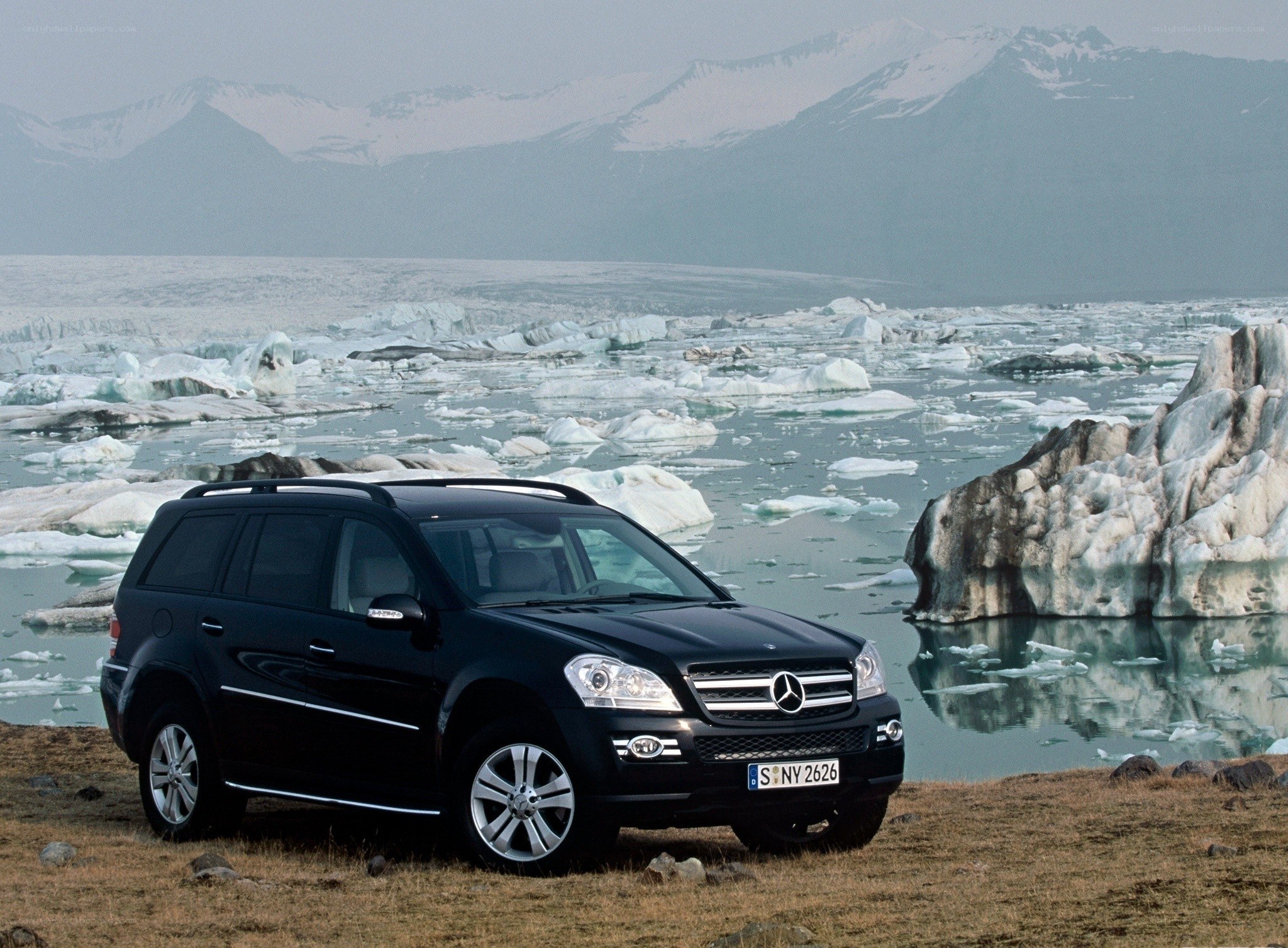 Black SUV in icy landscape