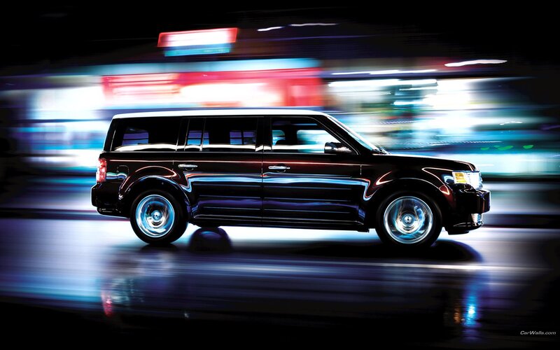 black suv in motion at night