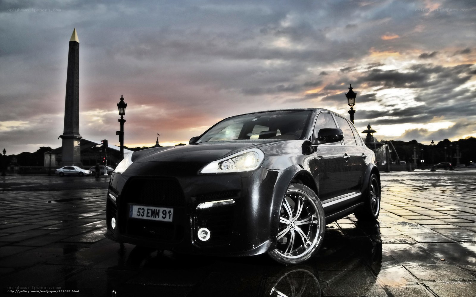 Black SUV in Paris at dusk