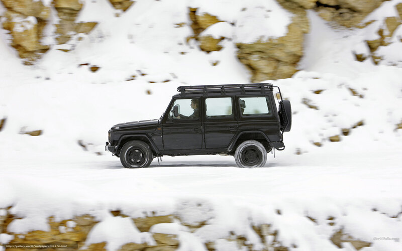 Black SUV in snowy landscape