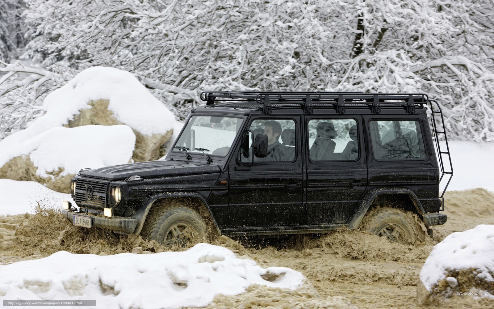 Black SUV in snowy terrain