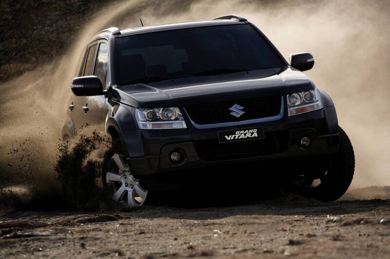 Black Suv Kicking Up Dust