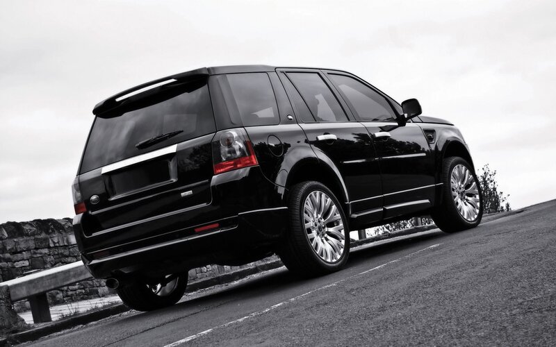 black suv on a road