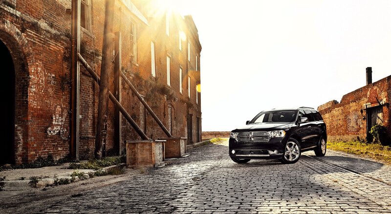 Black SUV on cobblestone street
