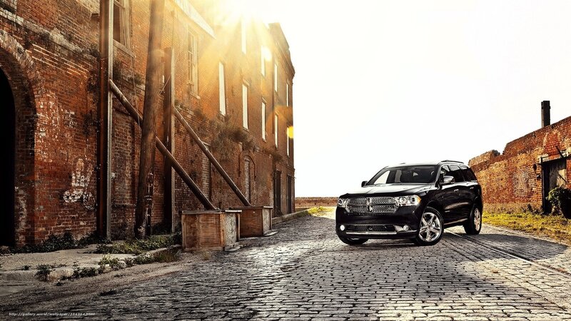 Black SUV on cobblestone street