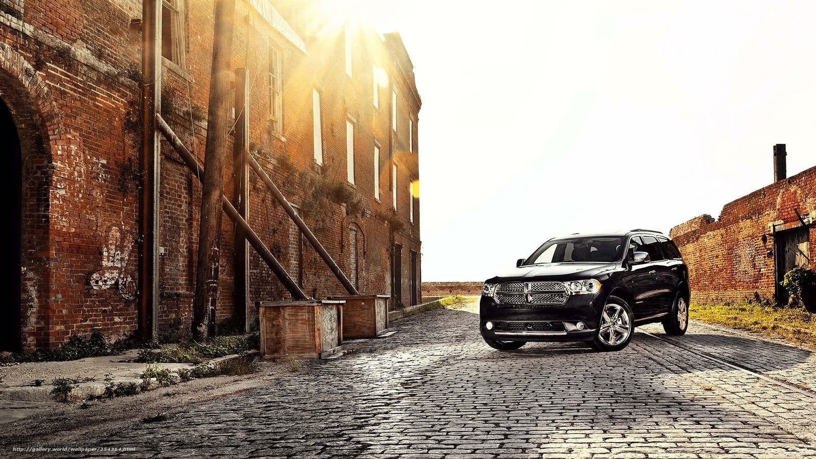 Black SUV on cobblestone street